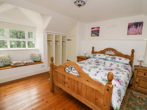 מיטה או מיטות בחדר ב-Spring Cottage