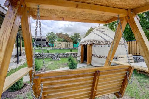 a gazebo with a yurt in a yard at Guest House NAUKA#54 in Bishkek