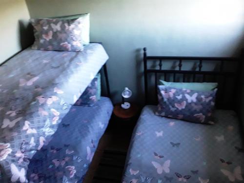 Un pat sau paturi într-o cameră la Eltos Karoo Stay Guest Farm