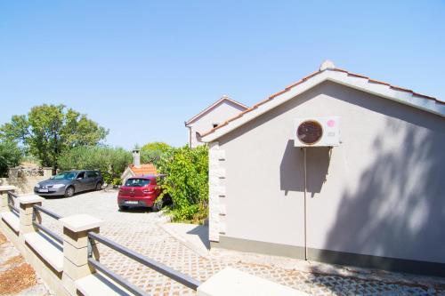 a building with a basketball hoop on the side of it at Villa Tereza in Splitska