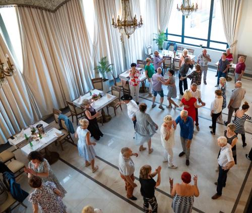 a group of people standing in a room at Boutique Odyseja & Spa in Ciechocinek