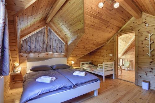 Un pat sau paturi într-o cameră la Chalet Alpin Mrkopalj