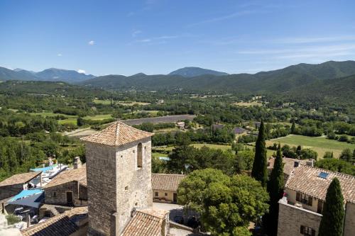 an aerial view of a village with mountains in the background at Domaine Les Sources de Dieulefit in Dieulefit