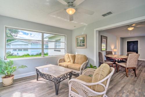 a living room with a table and chairs at Contemporary Gem with Sun Room in Beverly Hills! in Beverly Hills