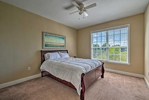 a bedroom with a bed and a ceiling fan at Bright Bayfront Home Less Than 2 Mi to Hernando Beach! in Hernando Beach