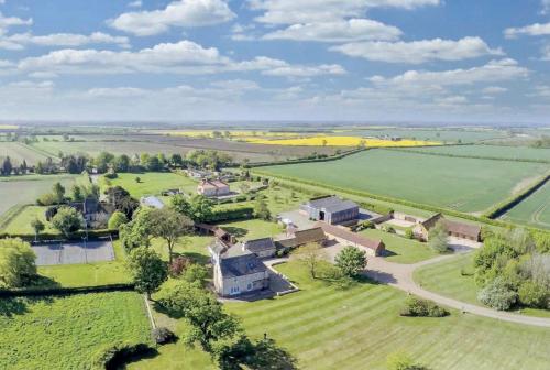 an aerial view of a house in a field at Charming Hen Cottage Countryside Retreat Lincoln in Lincoln