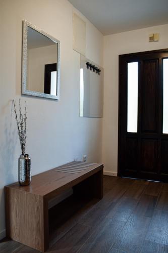 a room with a table and a mirror and a door at House Narta - Rastoke in Slunj