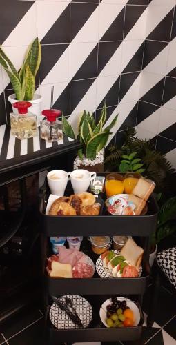 a shelf with different types of food on it at NeroBianco B&B Sorrento in Sorrento