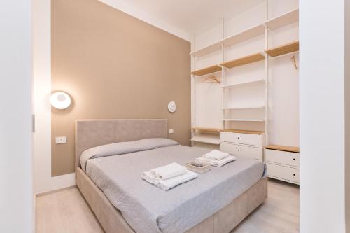 Posteľ alebo postele v izbe v ubytovaní MagnoliaApartments - 18A Visconti Duomo