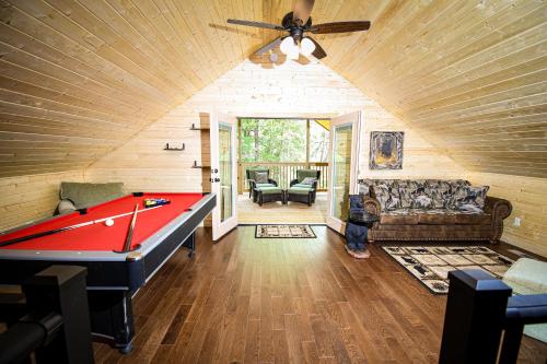 a room with a pool table in a house at Gatlinburg - Honeymoon Hideaway in Gatlinburg