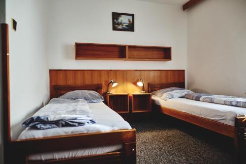 Tempat tidur dalam kamar di Motel Tošanovice