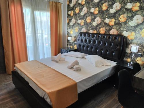 a bedroom with a large bed in a room at Apartment Julia in Paralia Katerinis