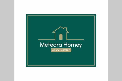 カランバカにあるMeteora Homeyの慈悲病院の緑色のロゴ
