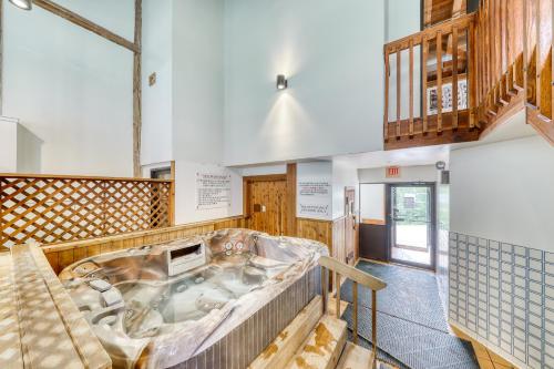 a large tub in the middle of a room at Mountainside resort H201 in Stowe
