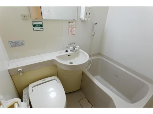 a small bathroom with a toilet and a sink at R&B Hotel Hakata Ekimae 1 - Vacation STAY 40720v in Fukuoka