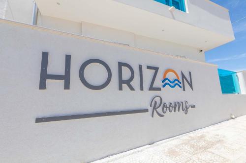 a honda sign on the side of a building at Horizon rooms in Torre Lapillo