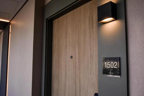 a door with a clock on it in a room at Rio Hotel by Bourbon Sao Paulo in Sao Paulo