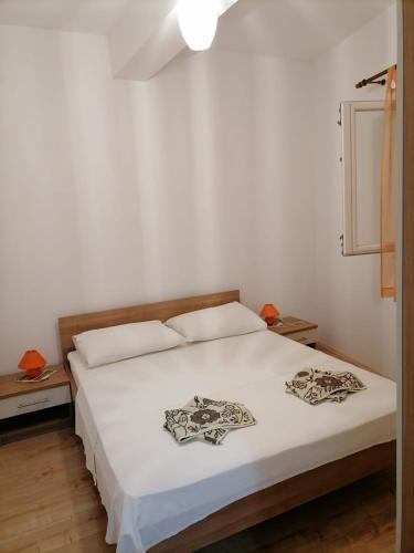 Giường trong phòng chung tại Apartmani Gajeta