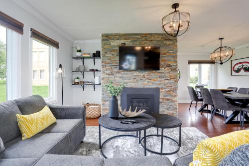a living room with a couch and a fireplace at Blue Mountain, 3 BR - 108 Mountain Walk Chalet in Blue Mountains