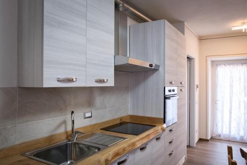 a kitchen with a sink and a stove at Ca de Mez in Luino