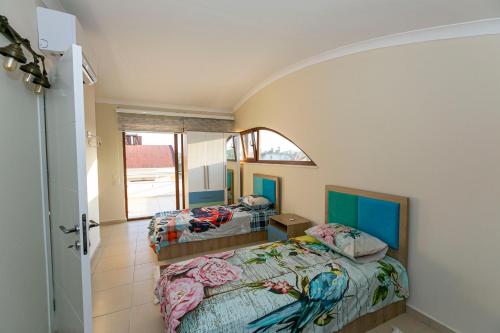 Postel nebo postele na pokoji v ubytování Paradise Town Villa Beliza