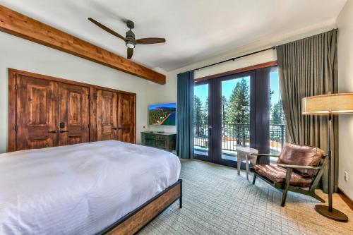 a bedroom with a bed and a chair and a window at Zalanta 328 - HVH3 in South Lake Tahoe