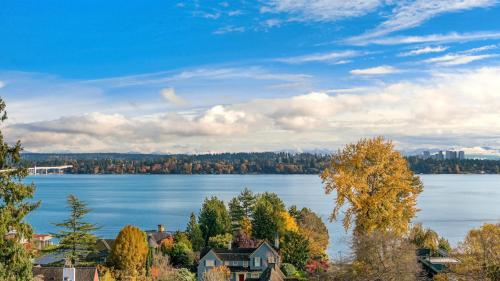 a view of a lake with houses and trees at Madison Park Seattle with Outdoor Private Garden and Grill 1BR 1BA in Seattle