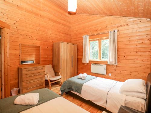 Кровать или кровати в номере Pochard Lodge