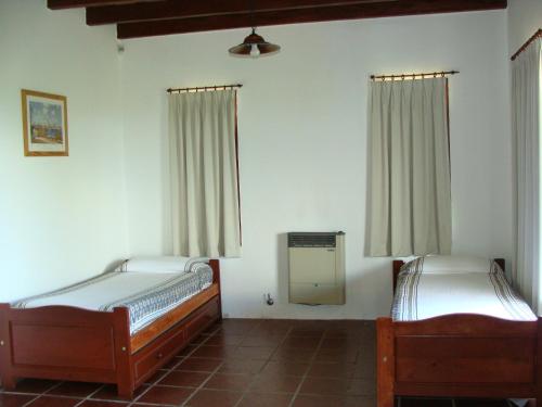 Un pat sau paturi într-o cameră la Vista del Condor