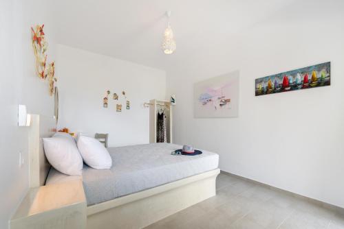 Ένα ή περισσότερα κρεβάτια σε δωμάτιο στο Moschatos Beach House