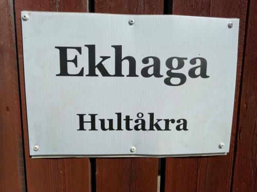 a sign on a wooden door that reads elhaba hilika at Ekhaga, Hultåkra in Mariannelund