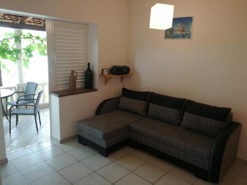 a living room with a couch and a table at Apartments Luna in Žuljana