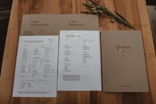 a table topped with a menu on a table at Apartment Andreas - Gallhof in Vollan