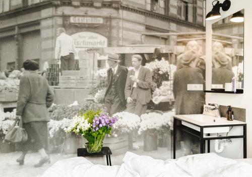 a black and white photo of people in a flower shop at Pyjama Park St Pauli Hotel und Hostel in Hamburg