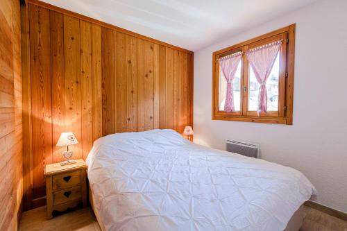 Giường trong phòng chung tại Le Bois du Suffin, Pied de pistes et Spa