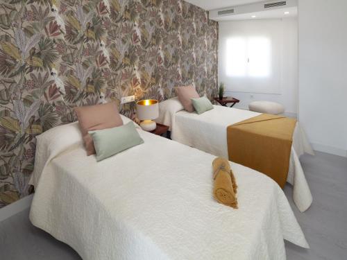 Posteľ alebo postele v izbe v ubytovaní INMálaga Penthouse Atarazanas