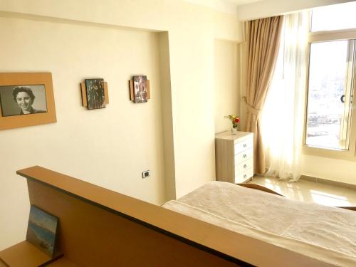 Postel nebo postele na pokoji v ubytování Alexander The Great Hotel