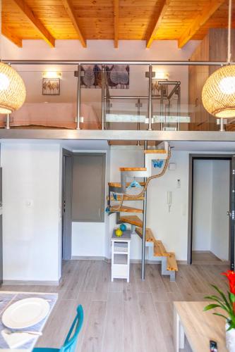 a room with a bunk bed and a ladder at Rethymno Garden Suites in Rethymno