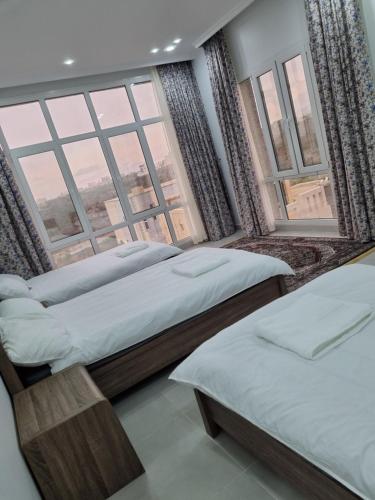 En eller flere senge i et værelse på فيلا الغروب الجبل الأخضر
