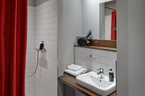 Koupelna v ubytování Kröger by Underdog Hotels