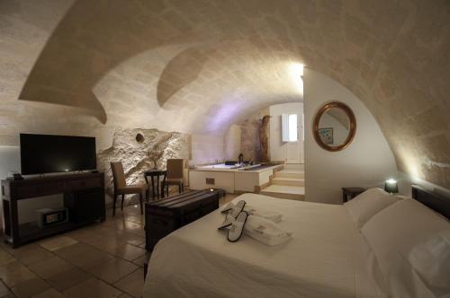 Una cama o camas en una habitación de Le Origini