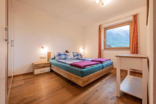 Giường trong phòng chung tại Landhaus Gletscherstern