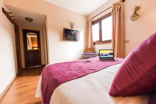 TV a/nebo společenská místnost v ubytování Tunqueley Hotel