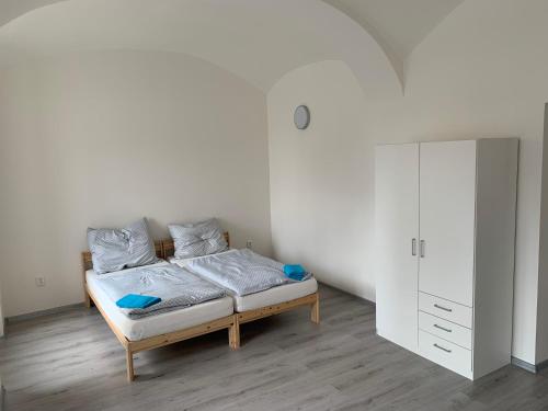 Postel nebo postele na pokoji v ubytování Apartmány Žižkova