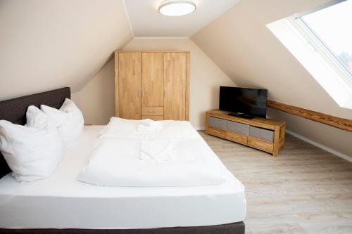 Ліжко або ліжка в номері Smart Resorts Haus Jade Ferienwohnung 204