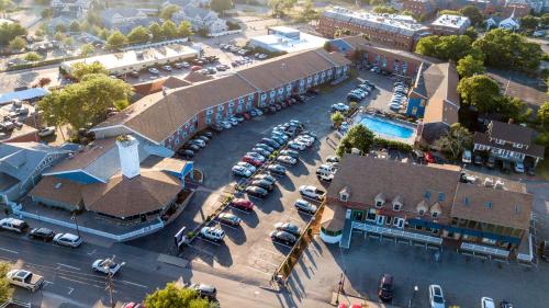 an overhead view of a building with cars parked in a parking lot at Hyannis Plaza Hotel in Hyannis