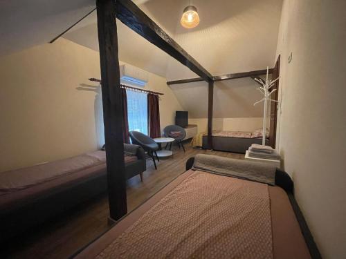 A bed or beds in a room at Battonya House