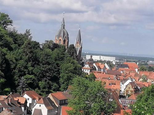 a view of a town with houses and two towers at Ferienwohnung Schaefer in Heppenheim an der Bergstrasse