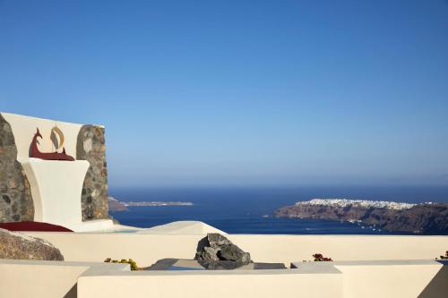 a view of the ocean from a white building at White Pearl Cavalieri in Imerovigli