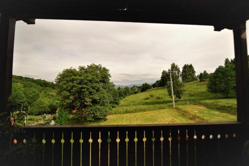 a window view of a field from a house at OVCA Apartament in Piechowice